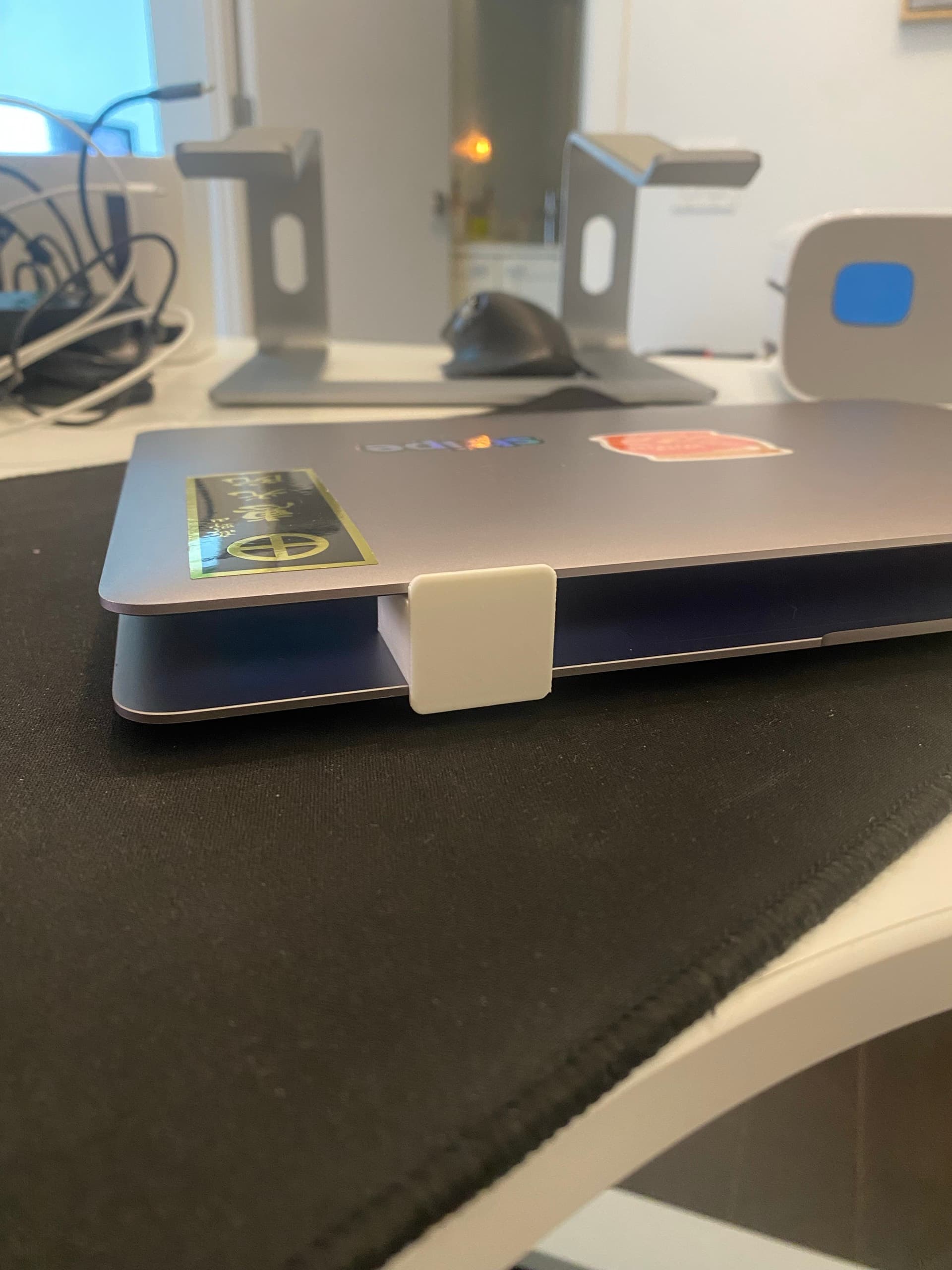 Wide view of AgentWedge holding a laptop open